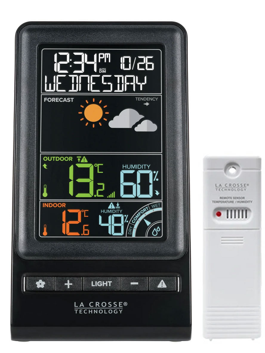 A digital weather forecast station with a color display showing temperature, humidity, and other weather indicators. The brand La Crosse Technology is visible.