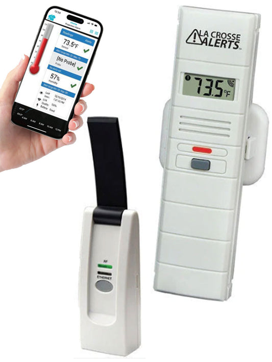 A white La Crosse temperature and humidity monitor with a digital screen and a mobile device displaying the temperature and humidity levels.