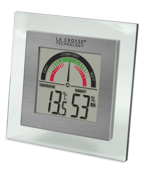 A digital La Crosse Comfort Meter with temperature and humidity readings, featuring a gray color scheme and a digital display.