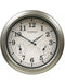 A round, silver-colored La Crosse indoor or outdoor wall clock with a metallic finish and analog display showing time, temperature, and humidity.