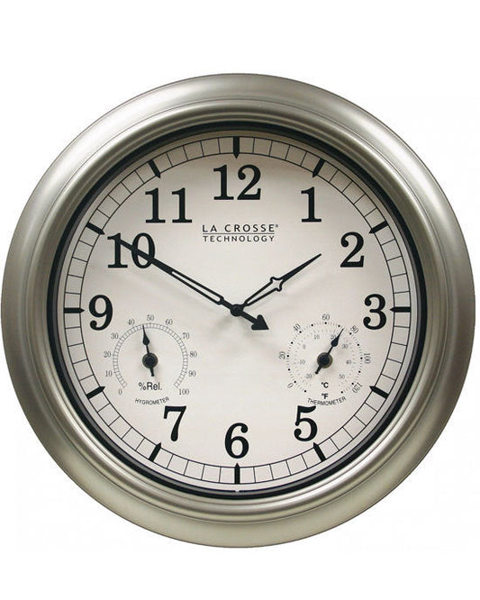 A round, silver-colored La Crosse indoor or outdoor wall clock with a metallic finish and analog display showing time, temperature, and humidity.